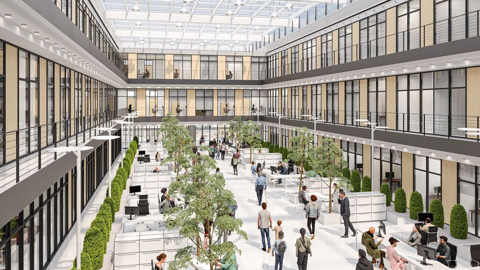 Die Halle ist lichtdurchflutet, wir sehen offene Büros und Grünpflanzen. Die Halle ist lichtdurchflutet, wir sehen offene Büros und Grünpflanzen.